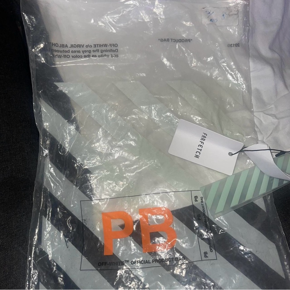 Off-White Striped Packaging With Orange Detail - image 3